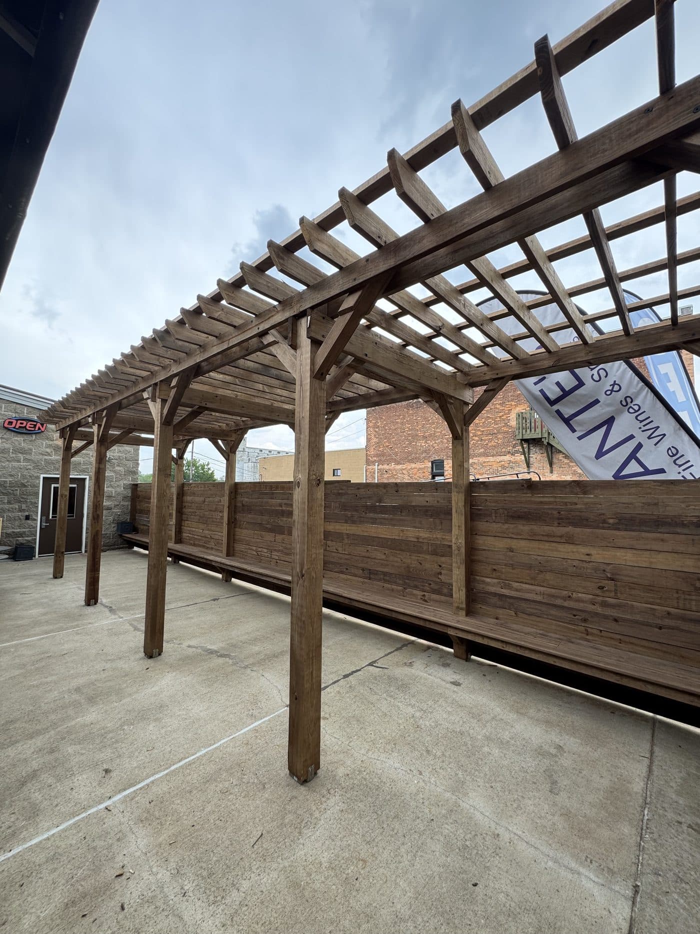 Custom cedar pergola built over a downtown patio